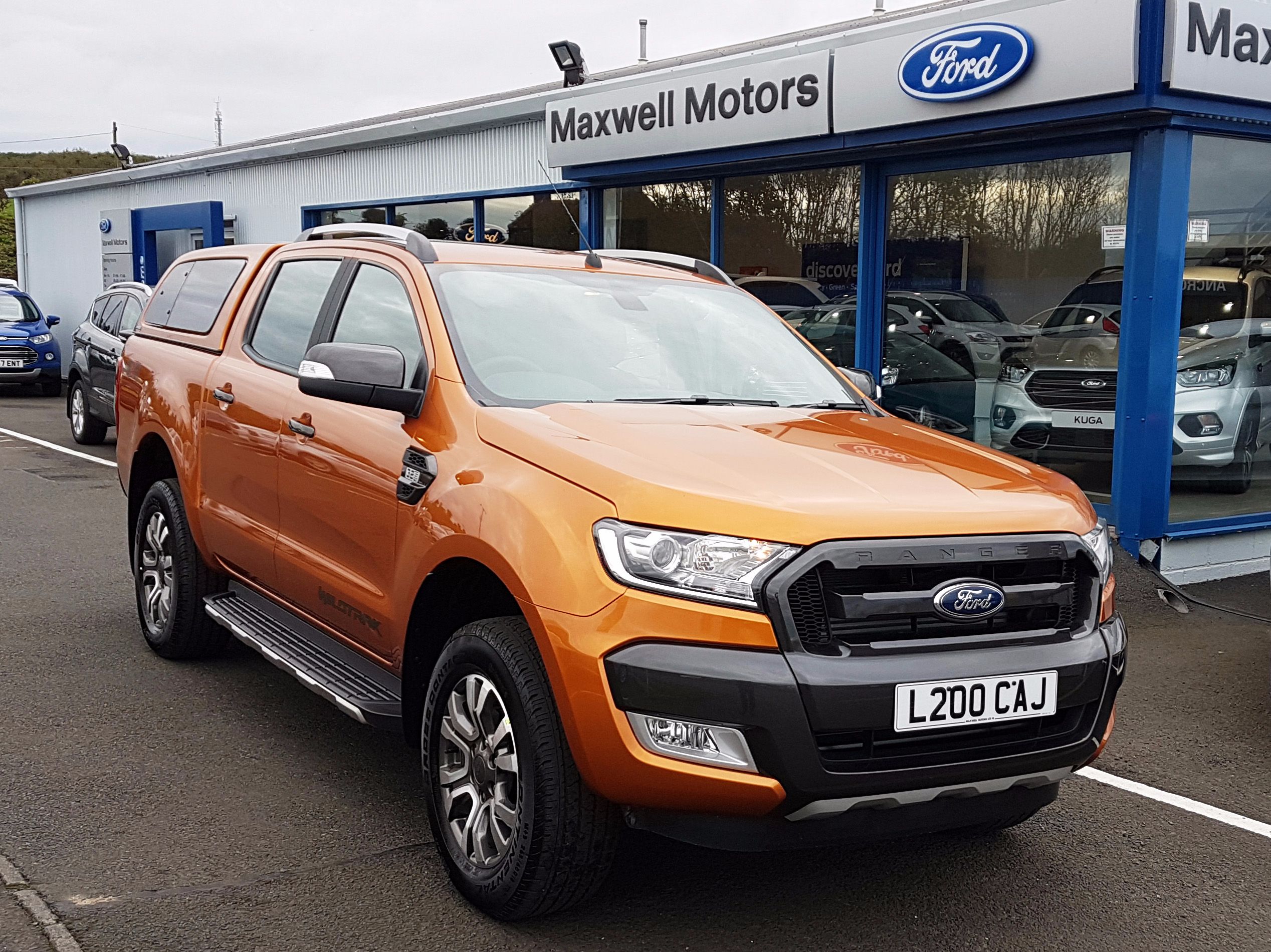 CUSTOMER COLLECTS PRIDE ORANGE WILDTRAK...